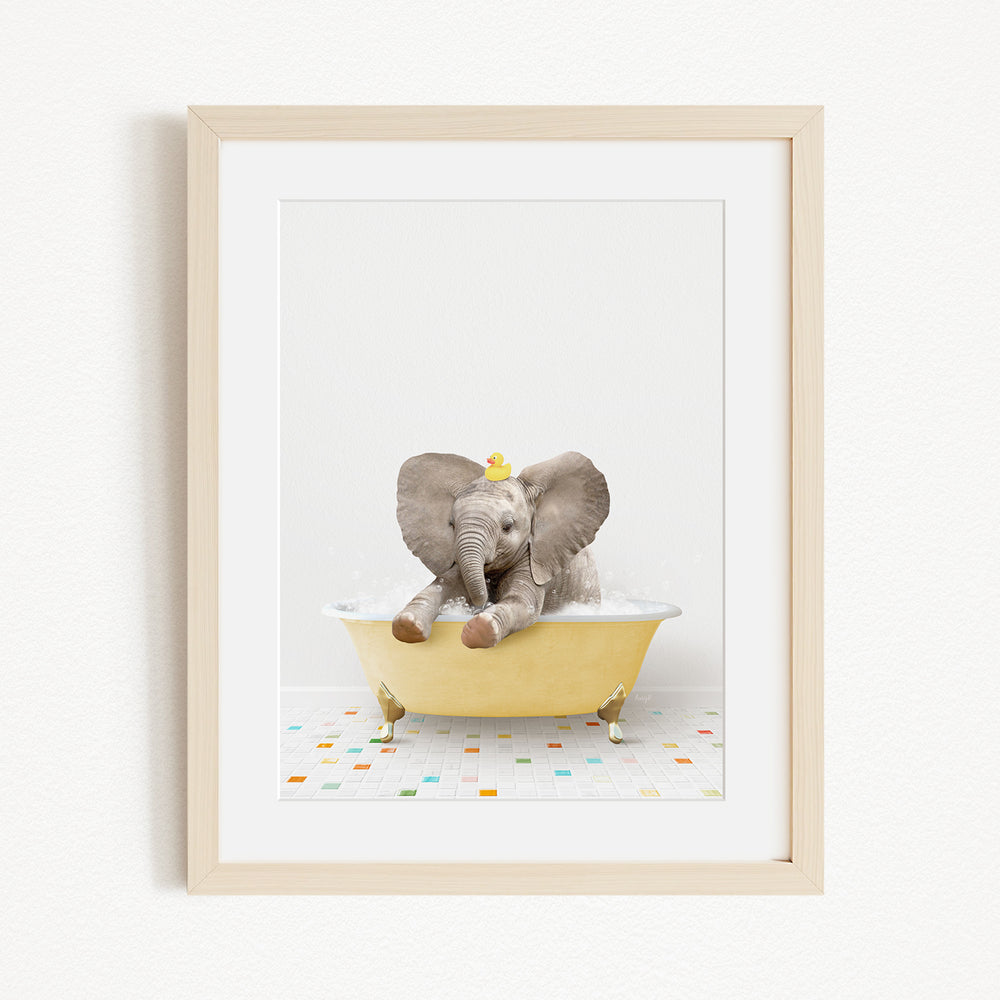 A baby elephant sitting in a yellow bathtub, surrounded by colorful tiles on the floor.