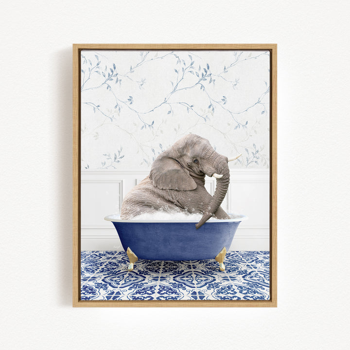 A gray elephant is sitting in a blue bathtub, surrounded by a blue and white patterned floor.