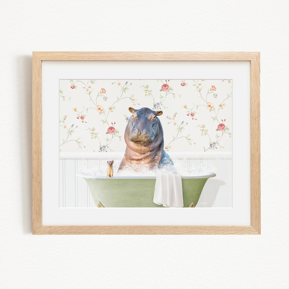 A hippopotamus sitting in a green bathtub, surrounded by a floral patterned wall.