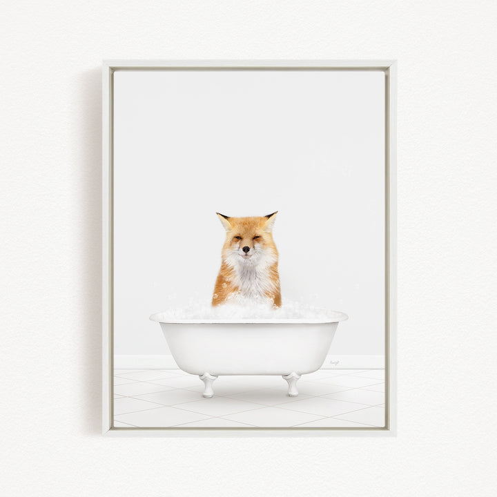 A red fox sitting in a white bathtub filled with bubbles.