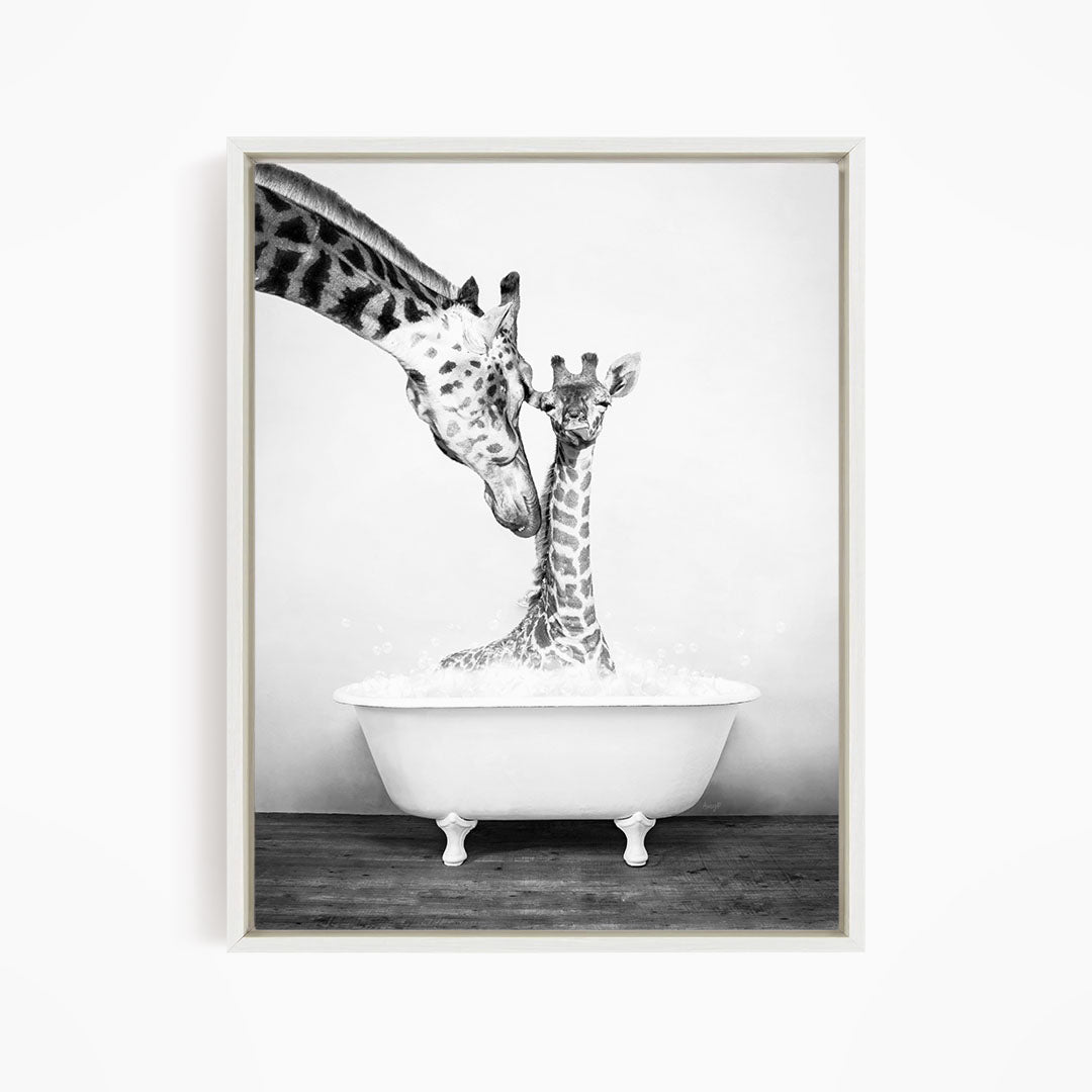 A mother giraffe and her baby giraffe enjoying a bath together in a white bathtub.