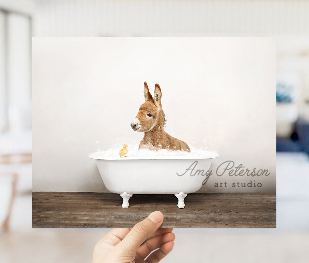 a person holding up a card with a picture of a dog in a bathtub