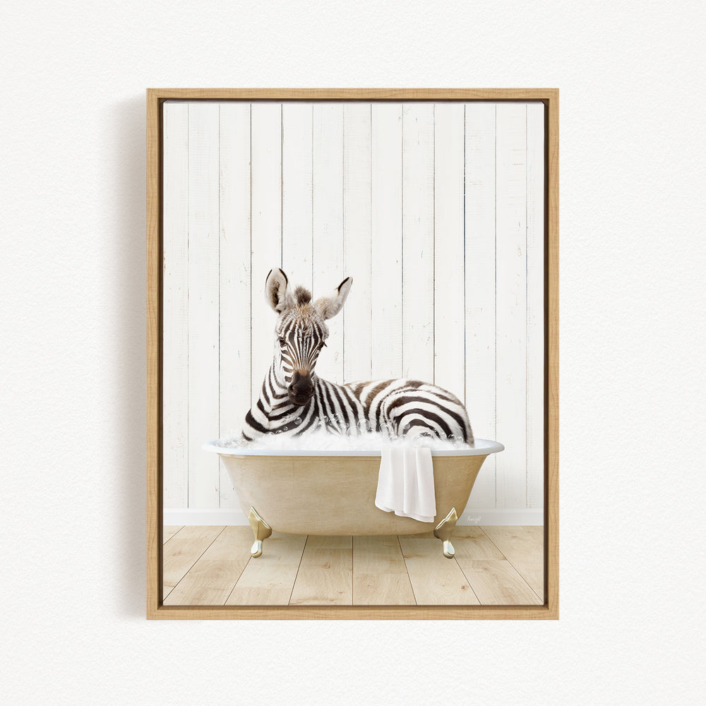 A zebra is sitting in a bathtub, with its head resting on a towel.