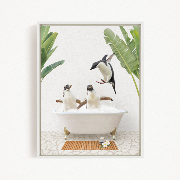 A framed image depicting three penguins sitting in a bathtub, surrounded by tropical plants and flowers.