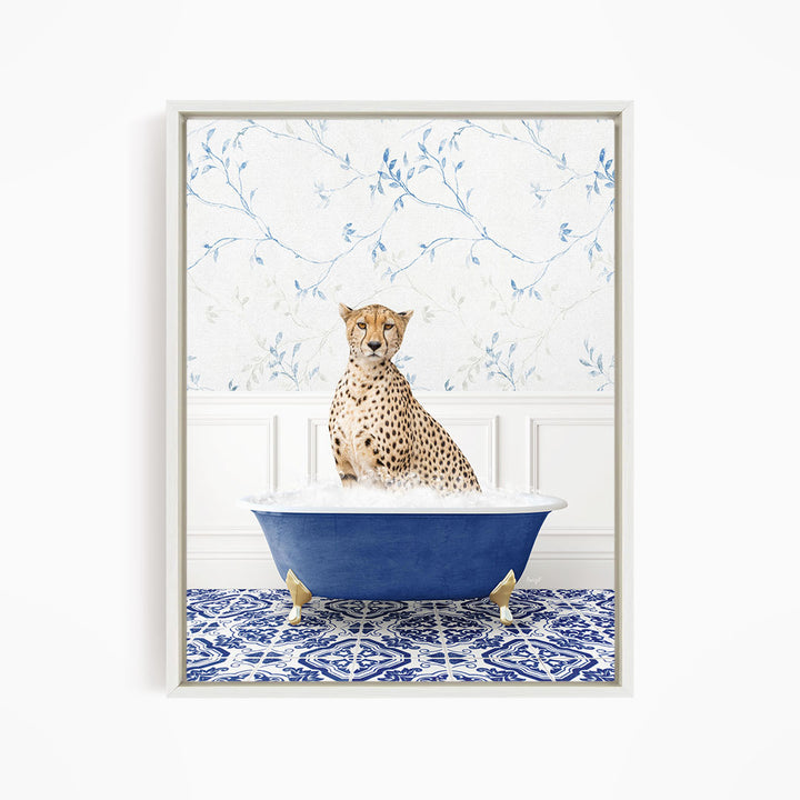 A cheetah sitting in a blue bathtub, with a patterned tile floor and a floral wallpaper in the background.
