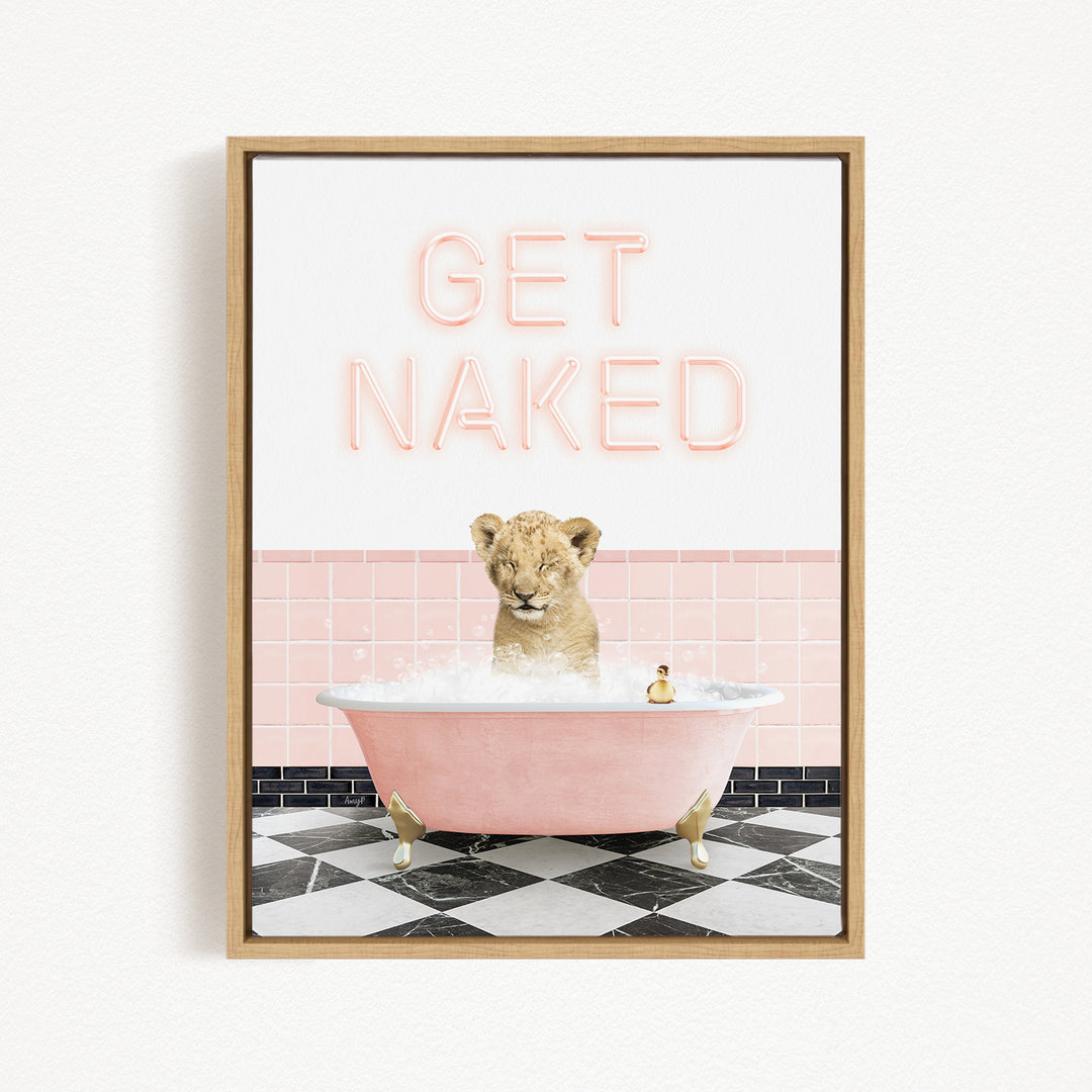 A framed image depicting a lion sitting in a pink bathtub, with the text "GET NAKED" displayed above it.