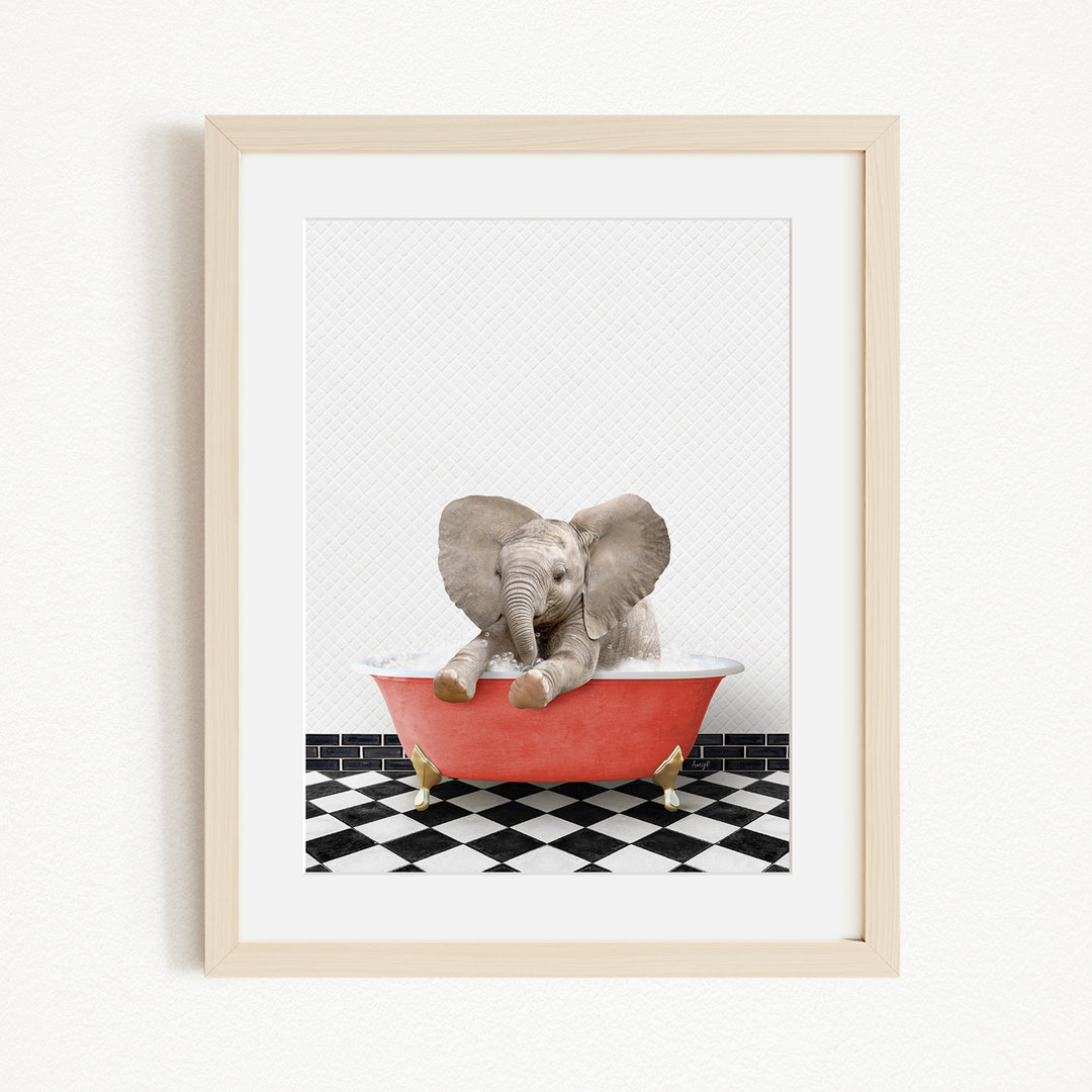 A baby elephant sitting in a red bathtub on a black and white checkered floor.
