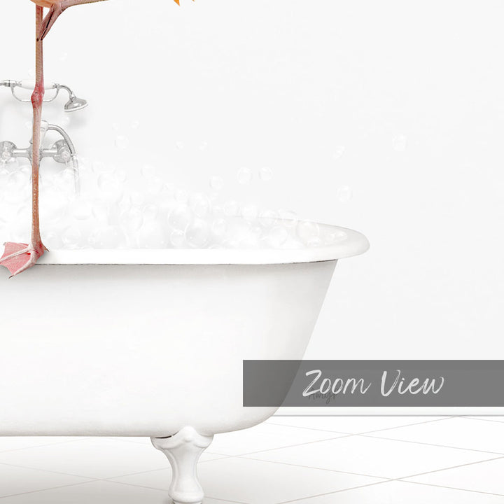 A white claw-foot bathtub filled with bubbles, with a pink object hanging from the side.