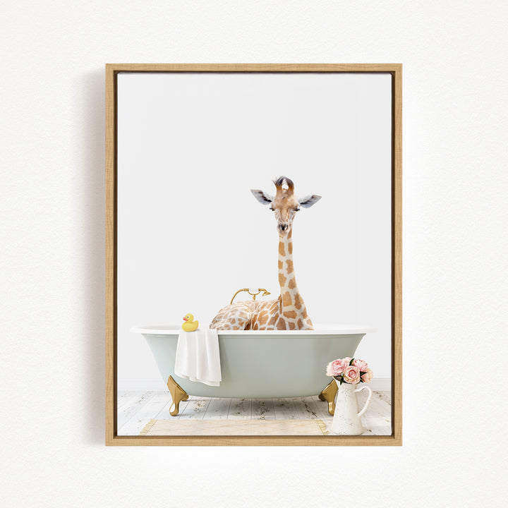 A giraffe sitting in a bathtub filled with water, surrounded by a yellow rubber duck and pink flowers.