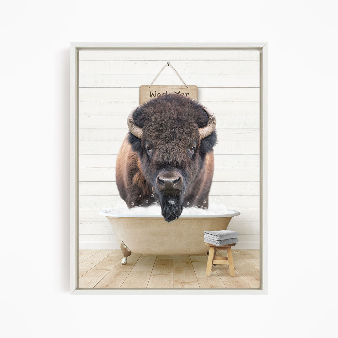 A buffalo with a long beard is sitting in a bathtub, with a sign above it that says "Wash your buffalo".
