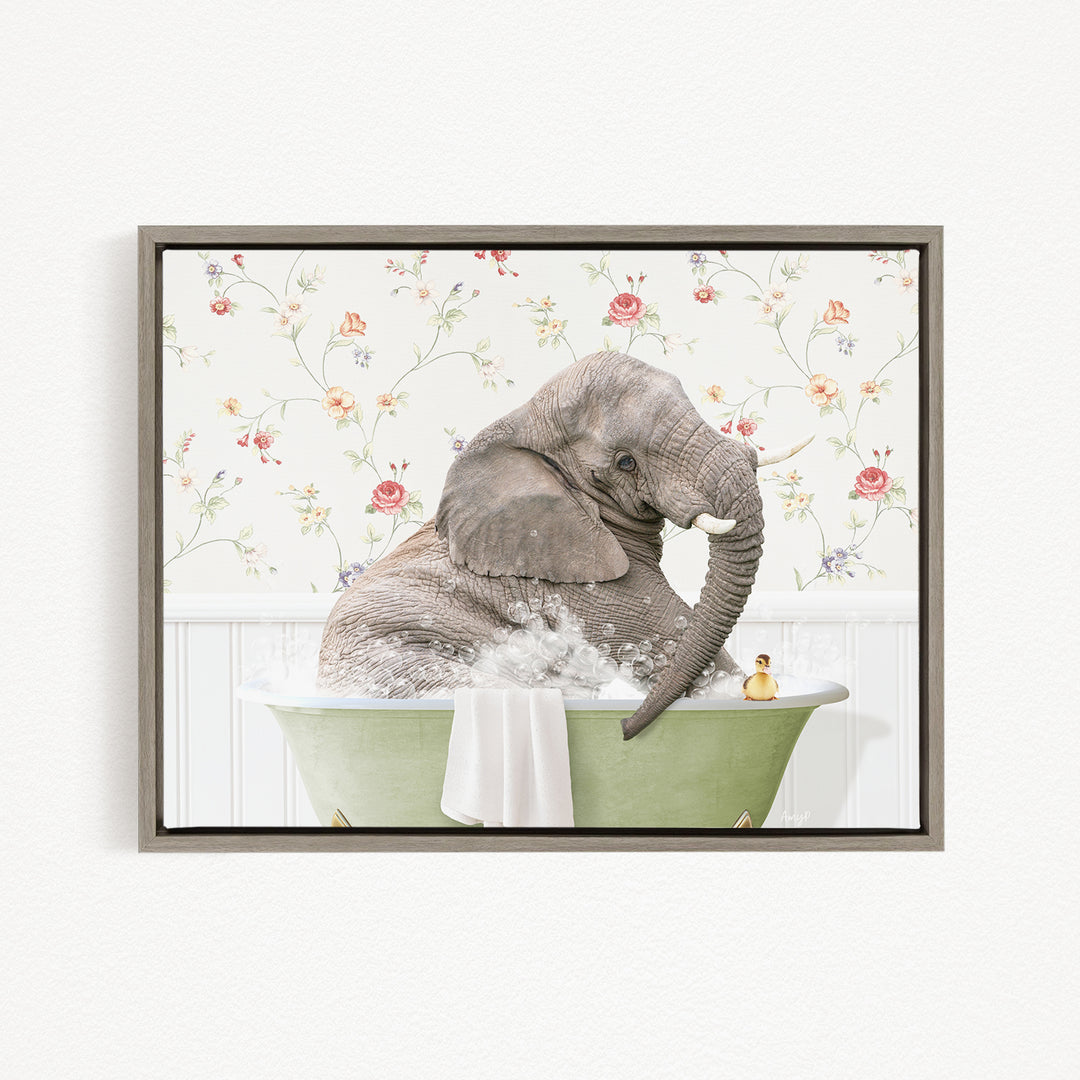 A gray elephant is sitting in a green bathtub, surrounded by a floral patterned wall.