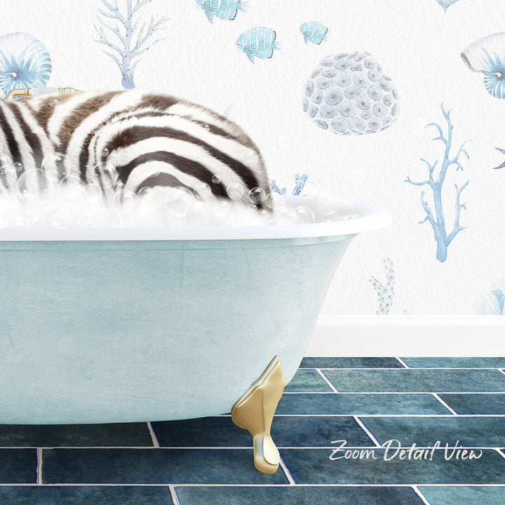 A zebra is sitting in a bathtub filled with bubbles, surrounded by a blue and white ocean-themed wallpaper.