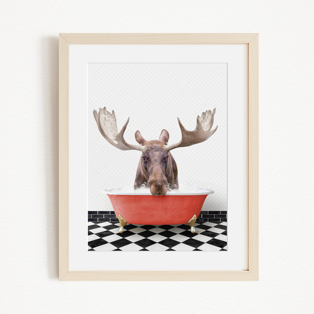 A moose with large antlers is sitting in a red bathtub, surrounded by a black and white checkered floor.