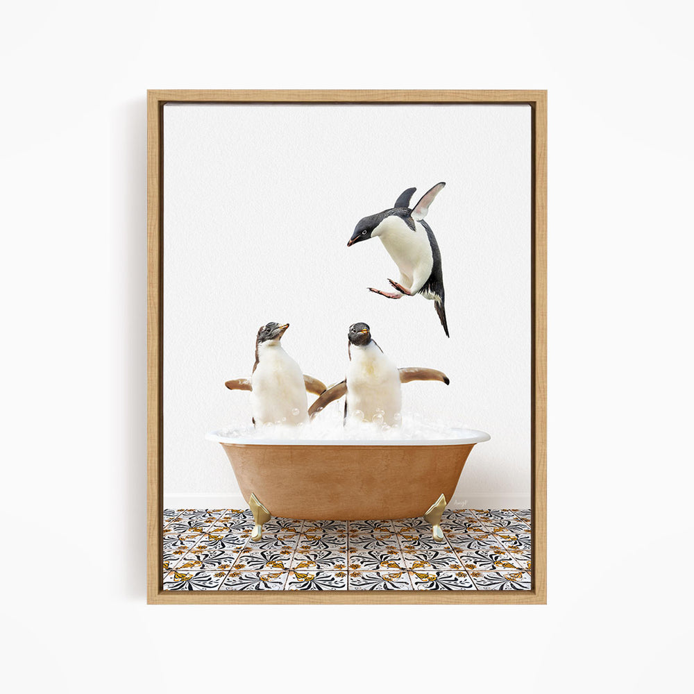 A framed image depicting three penguins in a bathtub, with one penguin flying above the tub.