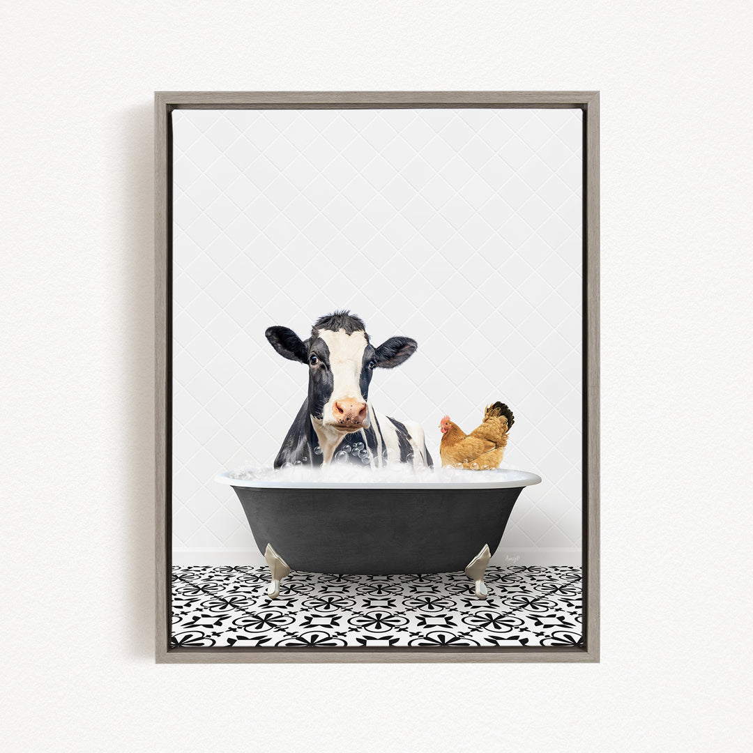 A black and white cow is sitting in a bathtub filled with water, with a chicken standing nearby.