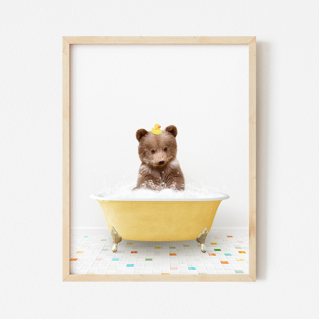 a small teddy bear sitting in a bath tub