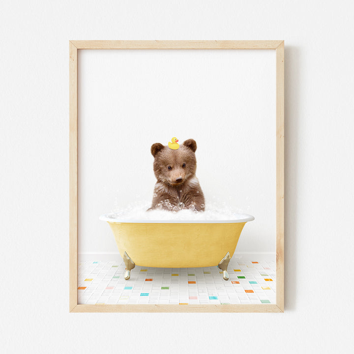 a small teddy bear sitting in a bath tub