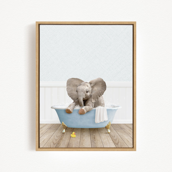 A baby elephant sitting in a blue bathtub, surrounded by rubber ducks, in a white-walled room with a wooden floor.