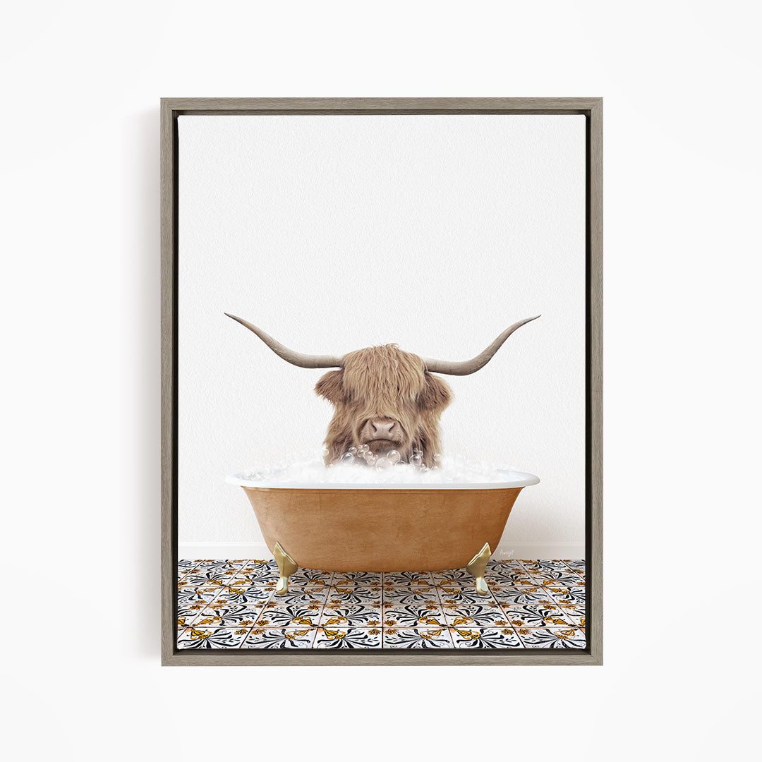 A Highland cow with large curved horns is sitting in a bathtub filled with water, creating a whimsical and playful scene.