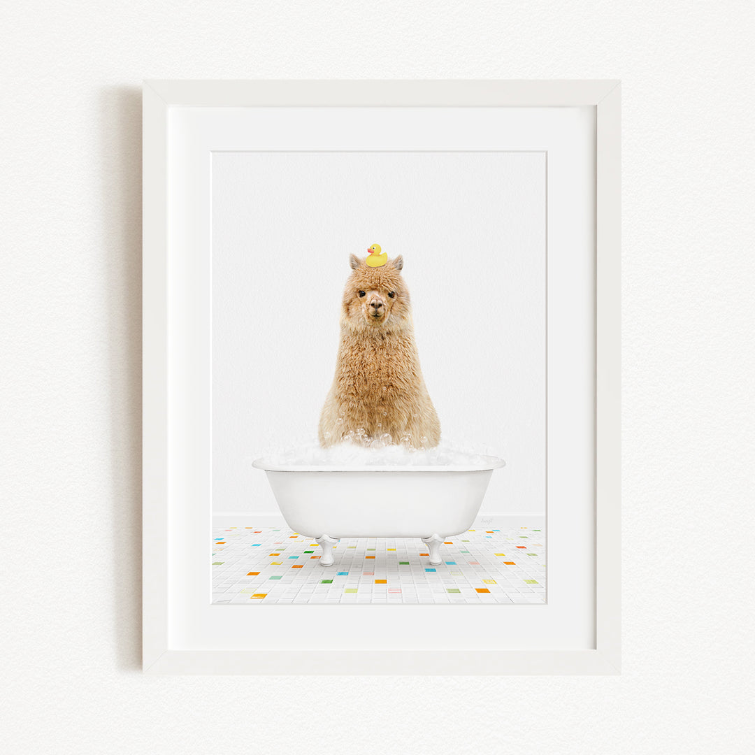 A fluffy brown dog sitting in a white bathtub filled with bubbles, wearing a yellow hat.