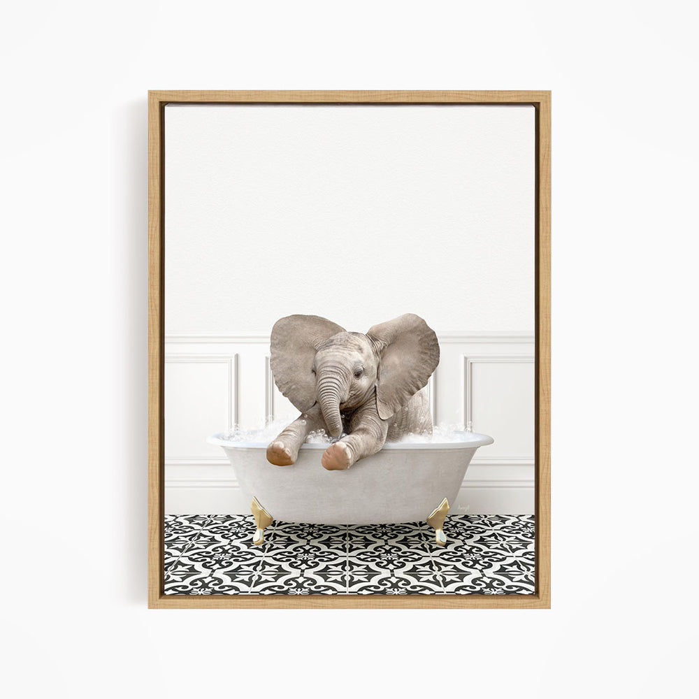 A baby elephant sitting in a white bathtub, surrounded by a black and white patterned floor.
