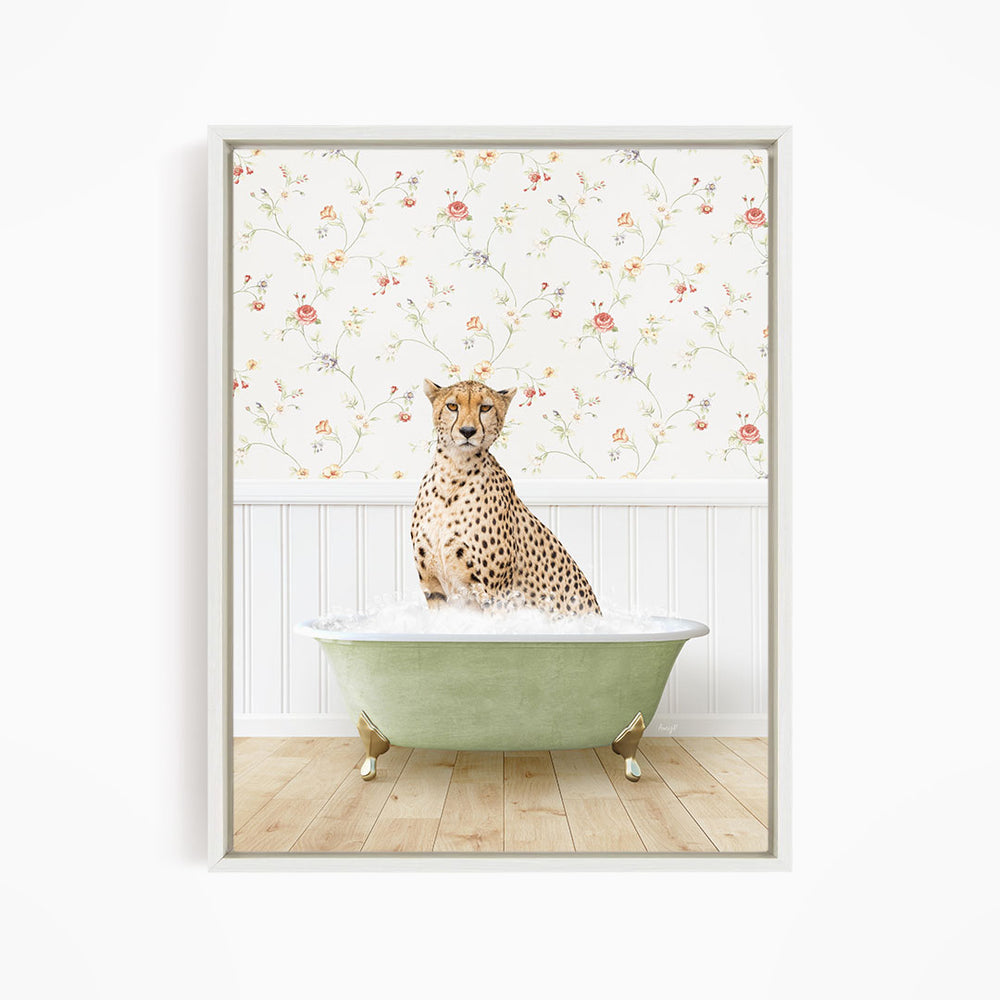 A cheetah sitting in a green bathtub filled with water, with a floral wallpaper in the background.