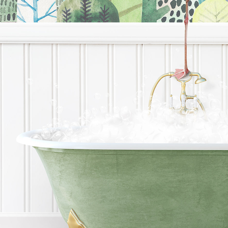 a green bathtub filled with white foam and a pink flamingo faucet