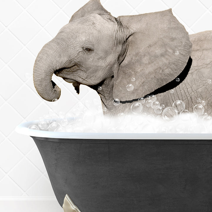 a baby elephant taking a bath in a bathtub