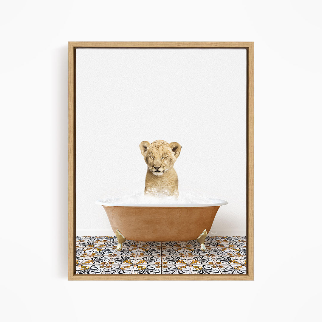 A young lion cub sitting in a bathtub filled with water, surrounded by a patterned tile floor.