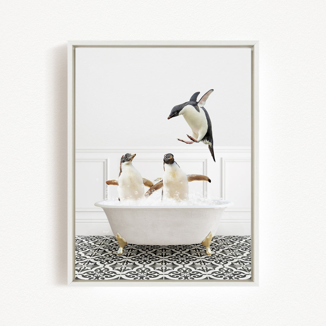A framed image depicting three penguins sitting in a bathtub, with one penguin flying towards the others.