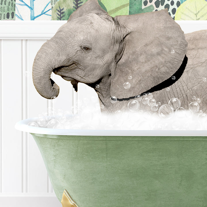 a baby elephant taking a bath in a green tub