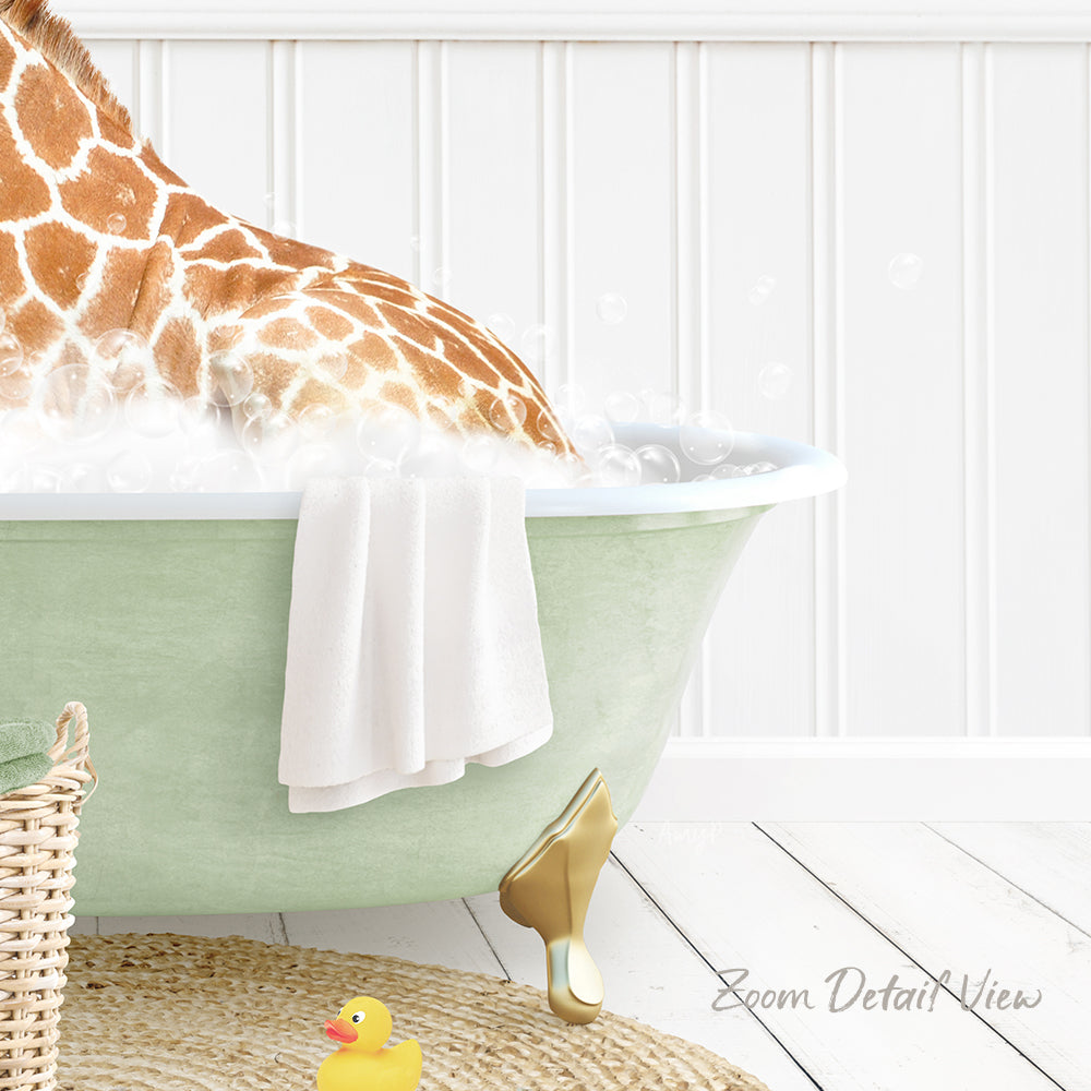 A giraffe is sitting in a green bathtub filled with water, surrounded by a yellow rubber duck and a white towel.