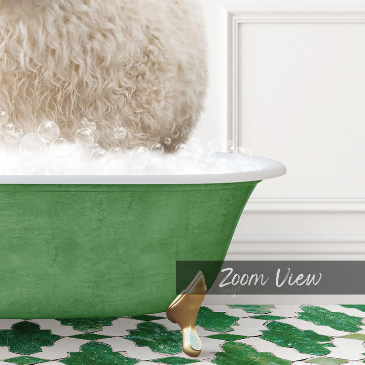 A fluffy white dog is sitting in a green bathtub filled with bubbles, with a gold faucet and a white wall in the background.