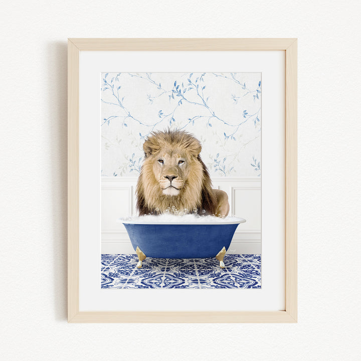 A lion sitting in a blue bathtub, surrounded by a blue and white patterned rug.