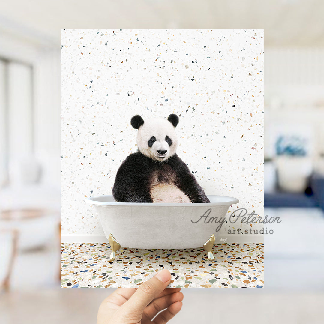 a panda bear sitting in a bath tub