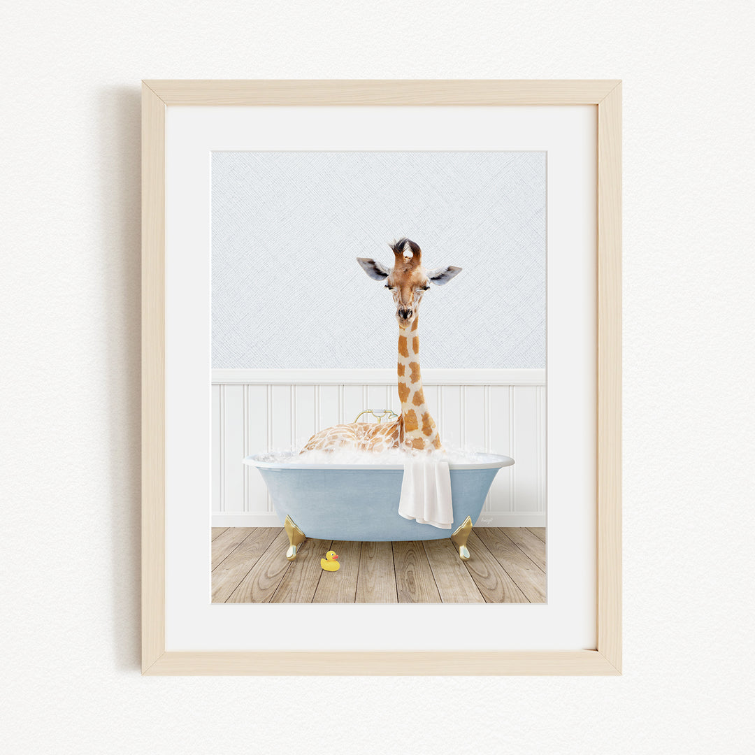 A giraffe standing in a blue bathtub filled with water, with a towel draped over its neck.