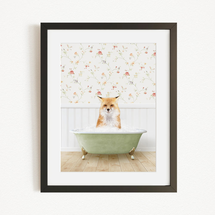 A fox is sitting in a green bathtub, surrounded by a floral wallpaper.
