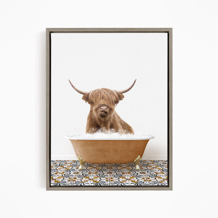 A Highland cow with long horns is sitting in a bathtub filled with water, creating a whimsical and amusing scene.