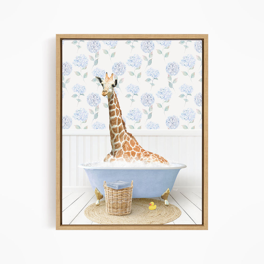 A giraffe is sitting in a blue bathtub filled with water, surrounded by a wicker basket and rubber ducks.