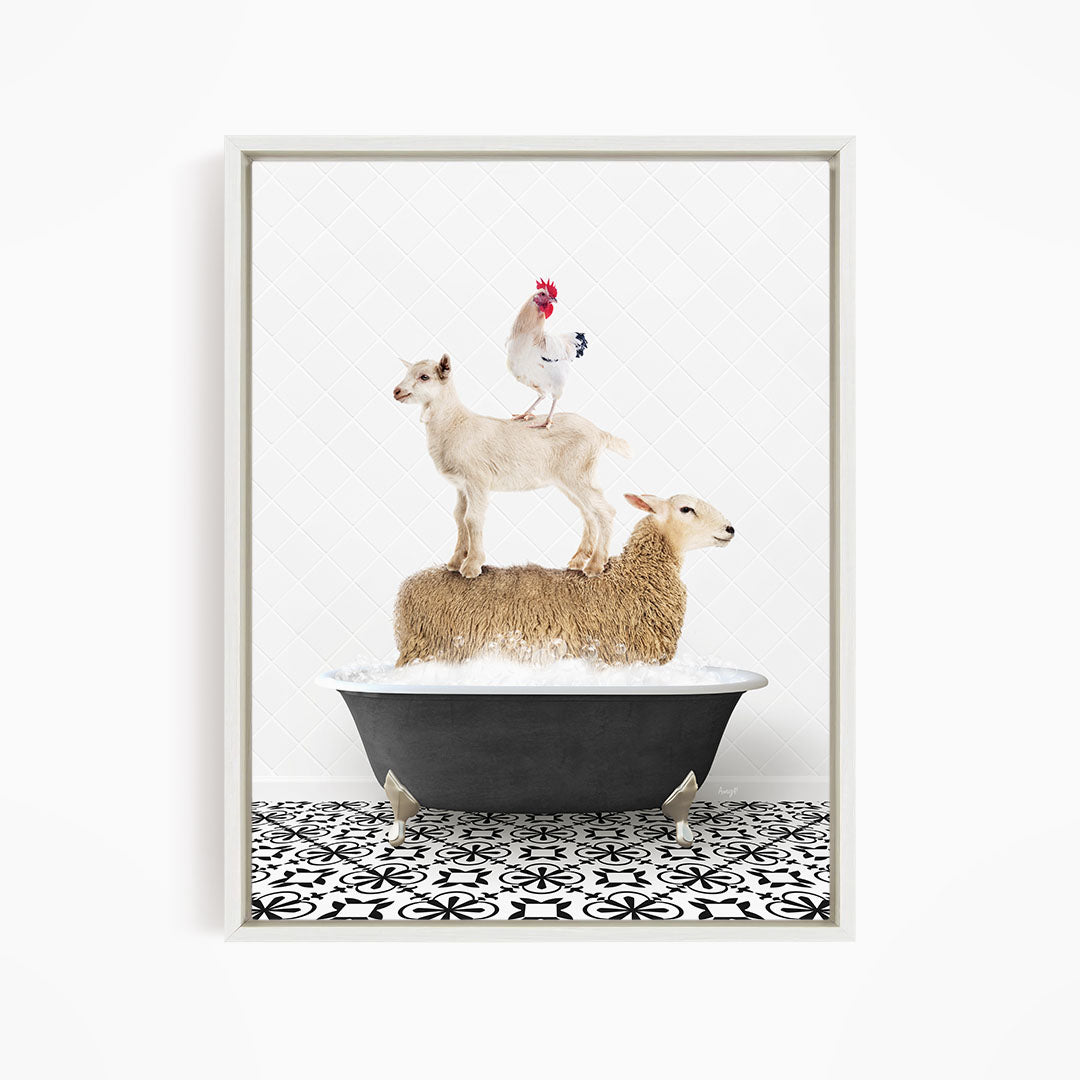 A framed image depicting a sheep standing on a goat's back while a chicken stands on top of a sheep in a bathtub.