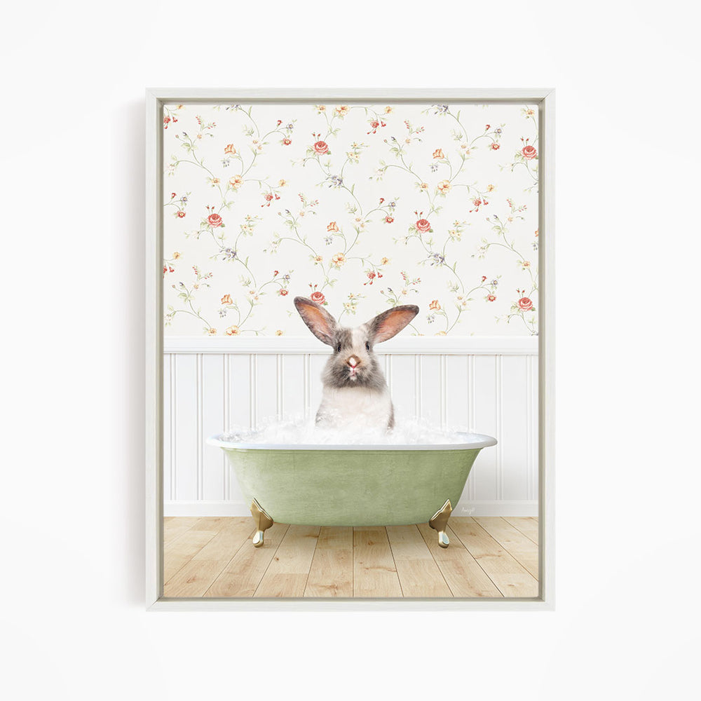 A white rabbit sitting in a green bathtub filled with water, with a floral wallpaper in the background.