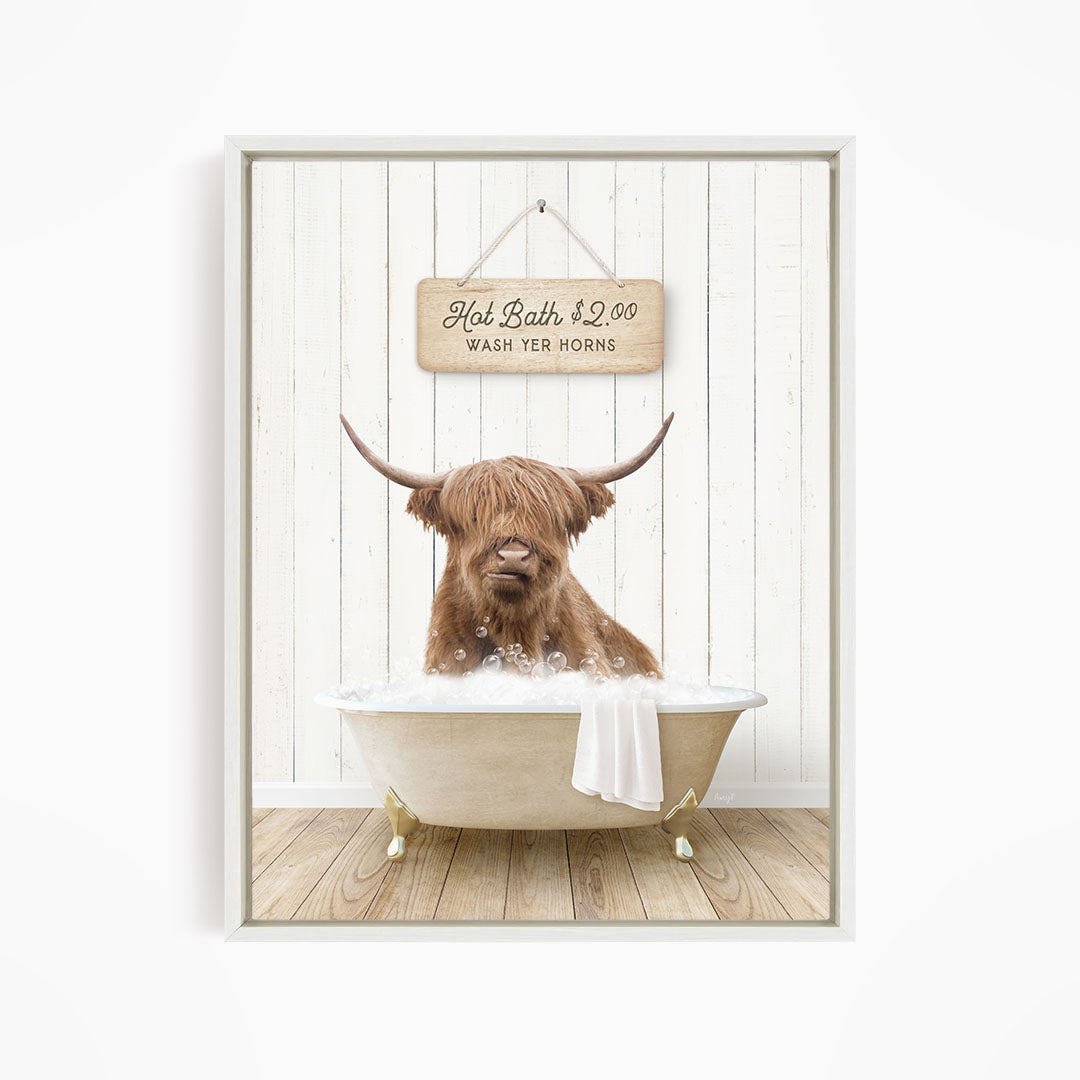 A brown Highland cow is sitting in a white bathtub, with a sign above it that reads "Hot Bath $2.00 WASH YER HORSES".