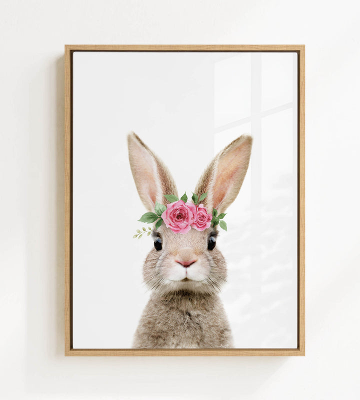 A picture of a rabbit wearing a flower crown on its head.