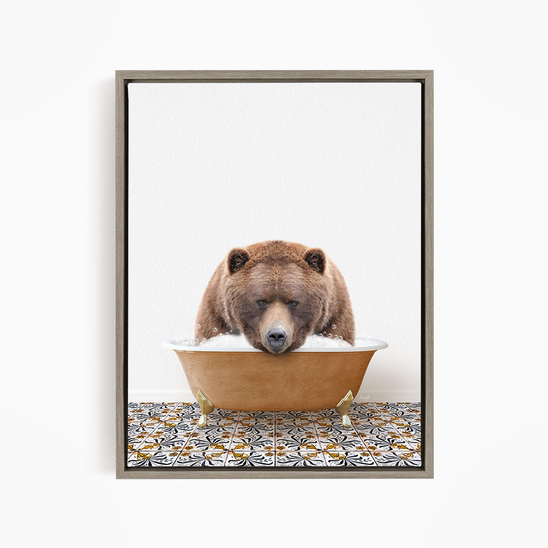 A brown bear is sitting in a bathtub filled with water, appearing to be enjoying the bath.