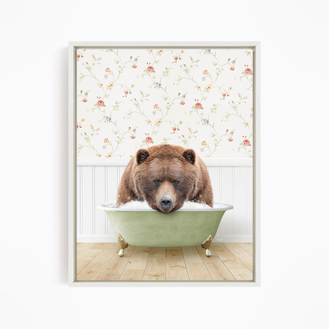 A brown bear is sitting in a green bathtub, appearing to be enjoying a relaxing bath.