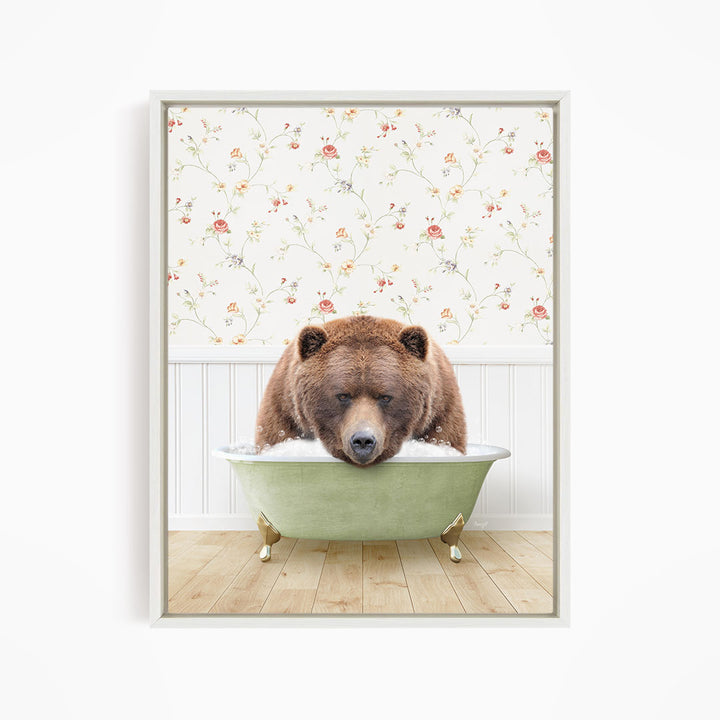 A brown bear is sitting in a green bathtub, appearing to be enjoying a relaxing bath.