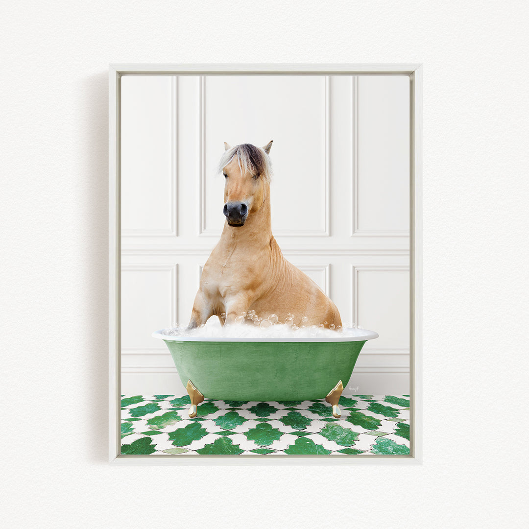 A light brown horse is sitting in a green bathtub filled with water, surrounded by a green and white patterned floor.