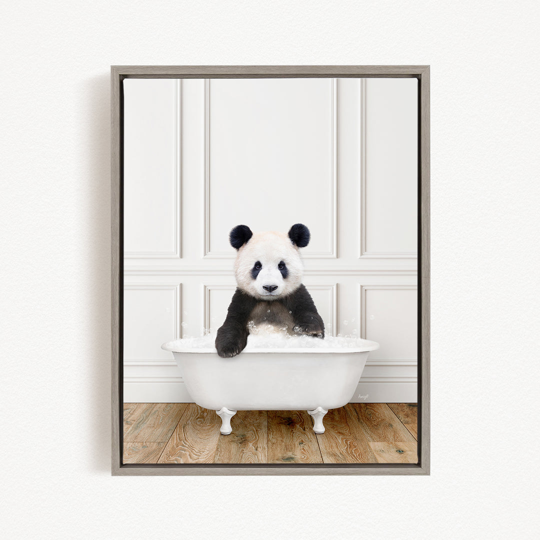 A panda bear sitting in a white bathtub filled with bubbles, looking directly at the camera.