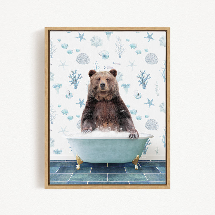 A brown bear sitting in a bathtub filled with bubbles, surrounded by a pattern of seashells and starfish on the wall behind it.