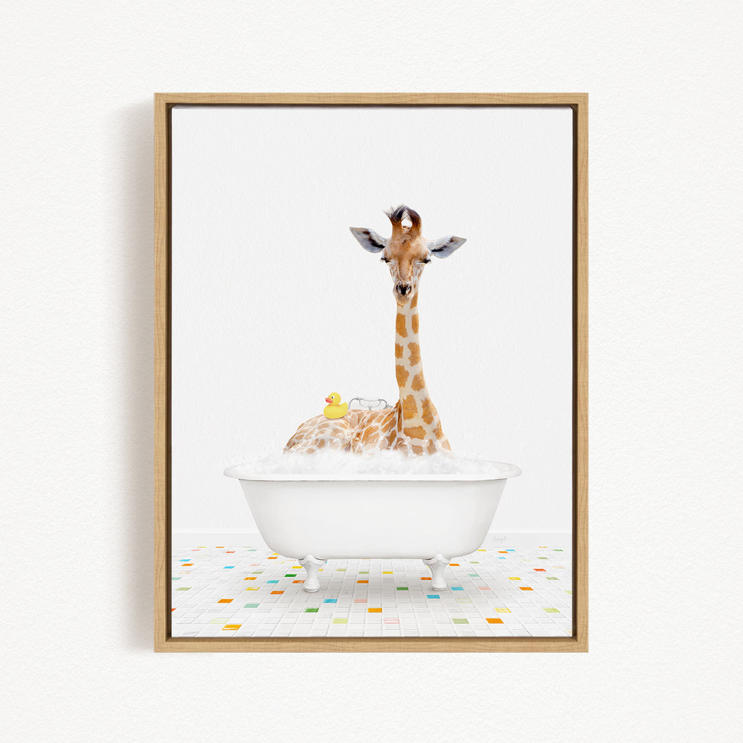 A giraffe is sitting in a white bathtub filled with bubbles, surrounded by a yellow rubber duck.